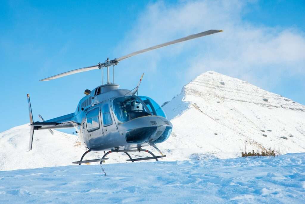 gray helicopter on sunshine peak in Gulmarg