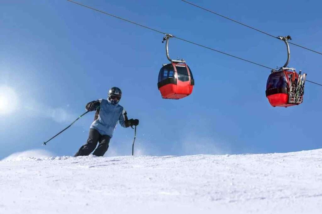 Person Riding Ski on Snow Field skiing in Gulmarg- Kashmir cab service