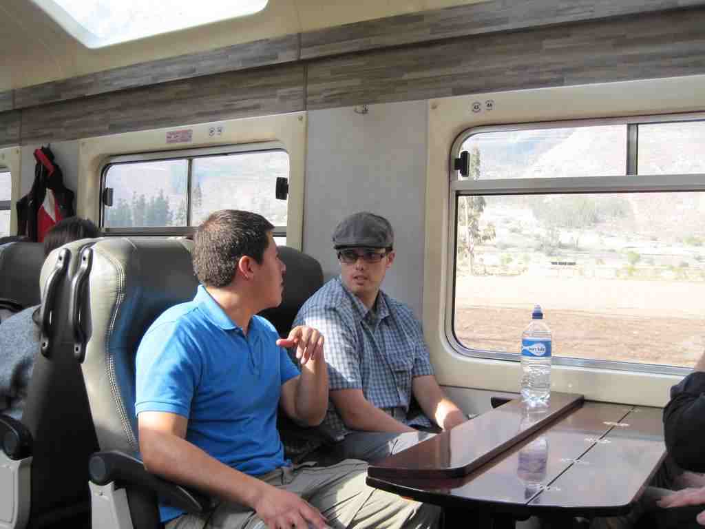 Tourists chat on the Vistadome Train in Kashmir