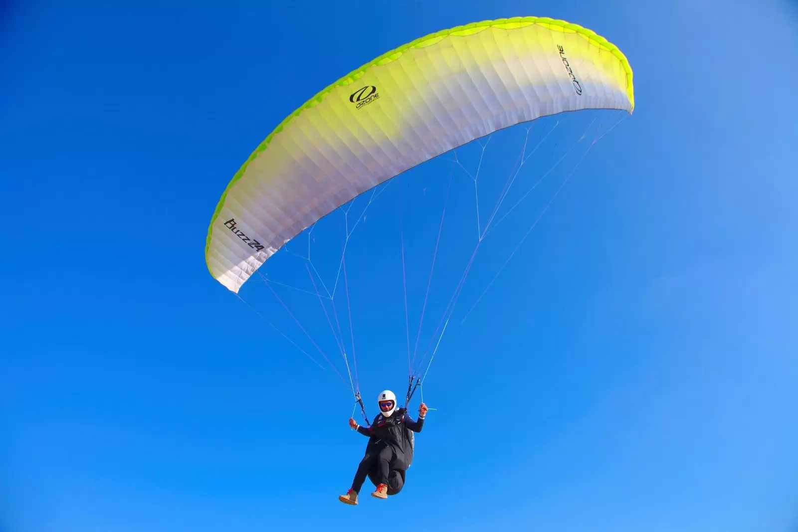 person paragliding in blue sky- Srinagar paragliding