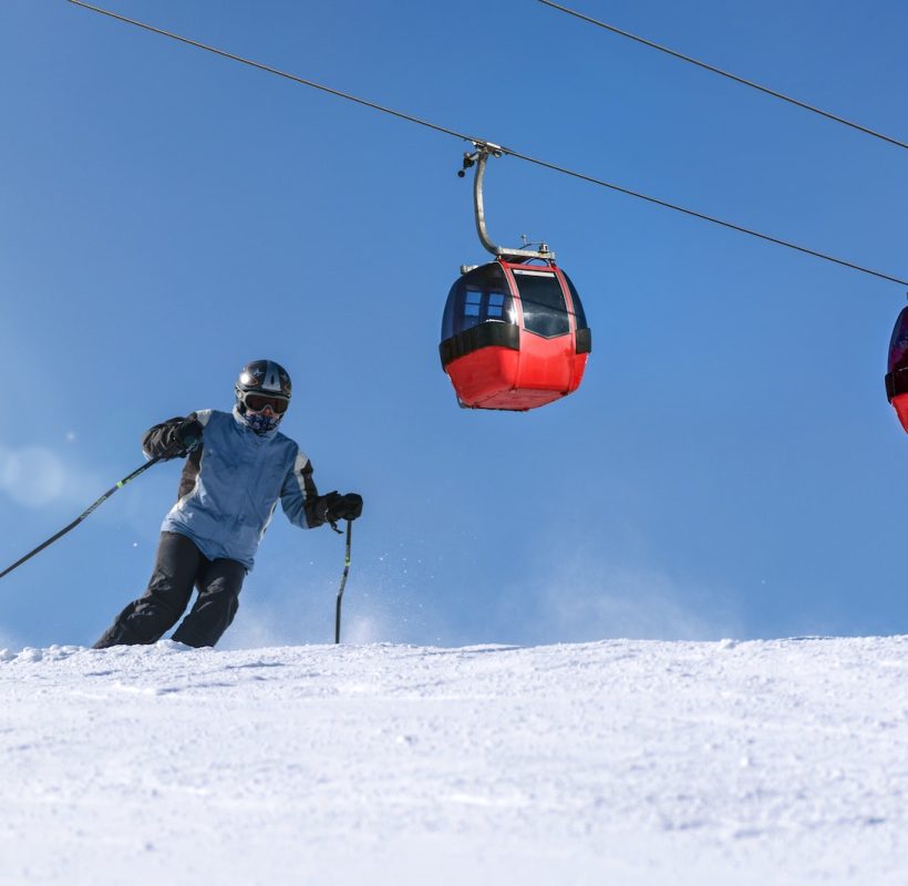 Person Riding Ski on Snow Field | skiing in Gulmarg- Kashmir cab service