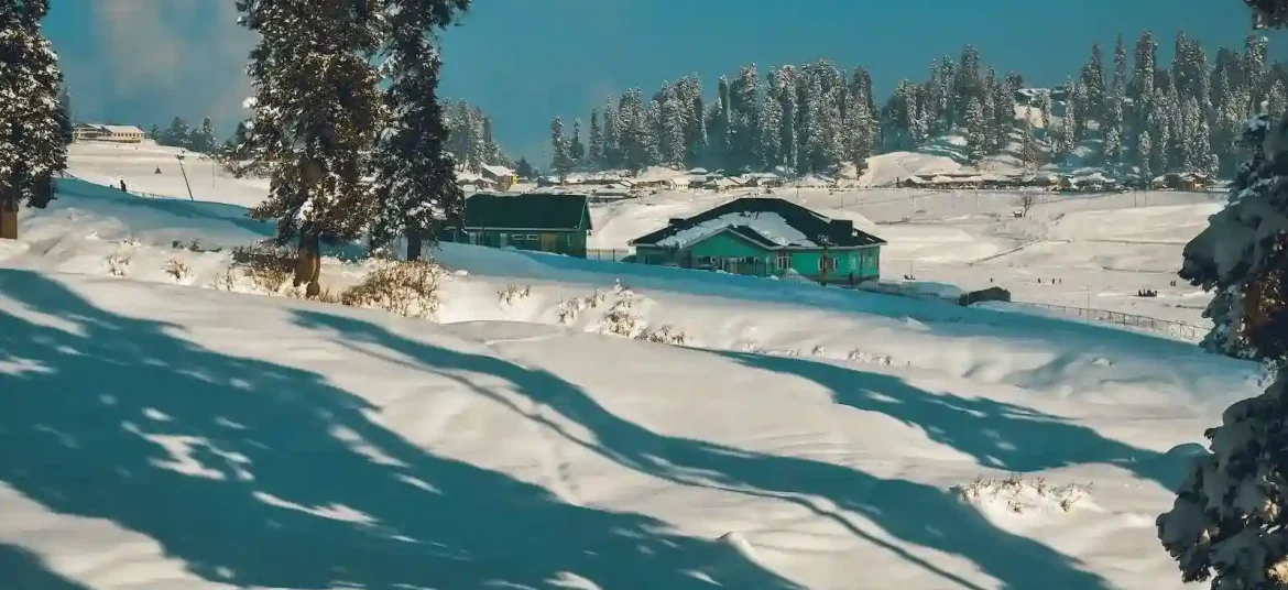 Kashmir in december (a snow covered hill with a house in the distance) (2)