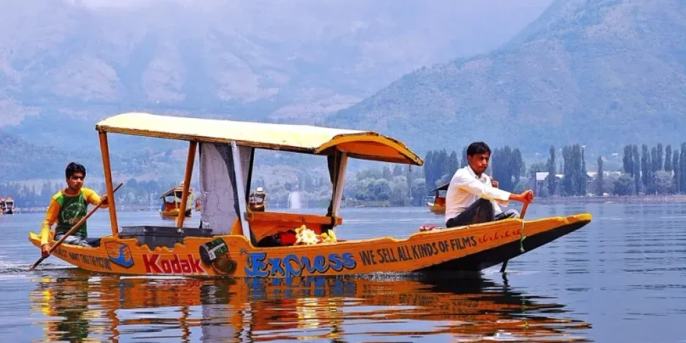 Two boys while enjoying the shikara ride in dal lake srinagar