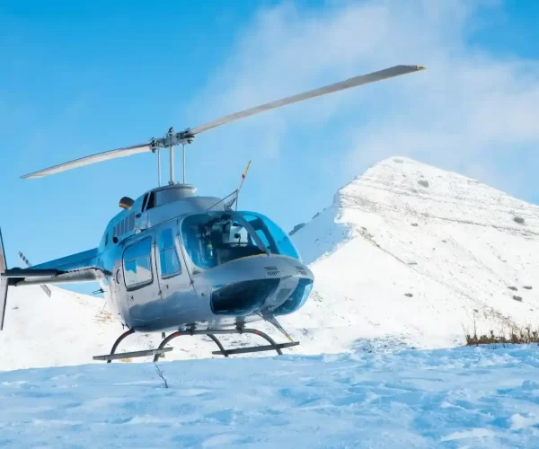 gray helicopter on sunshine peak in Gulmarg